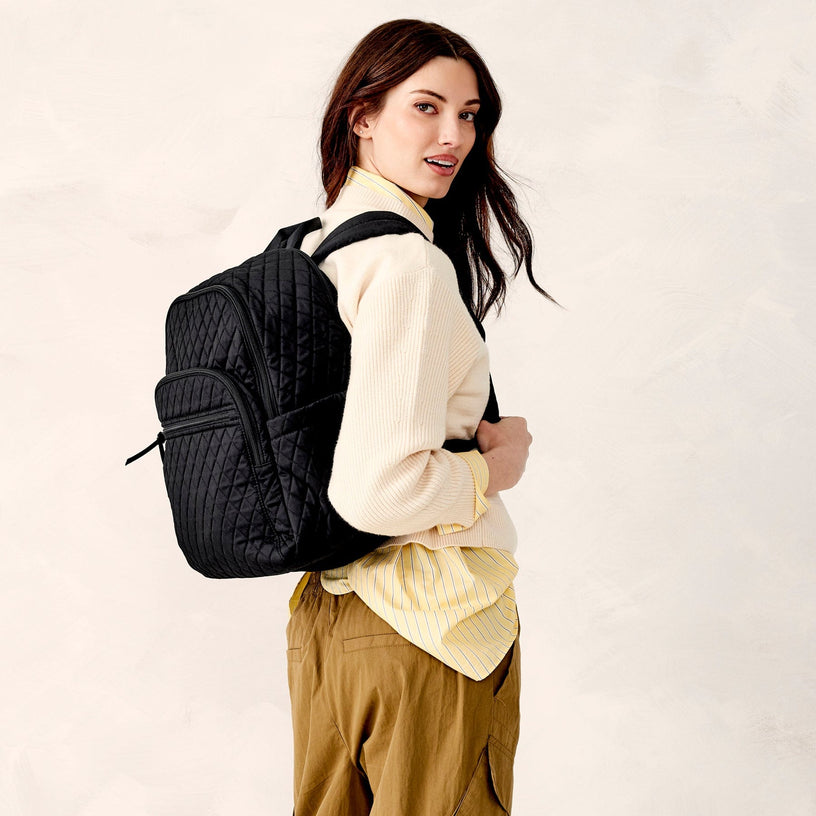 Model wearing black quilted cotton backpack for school