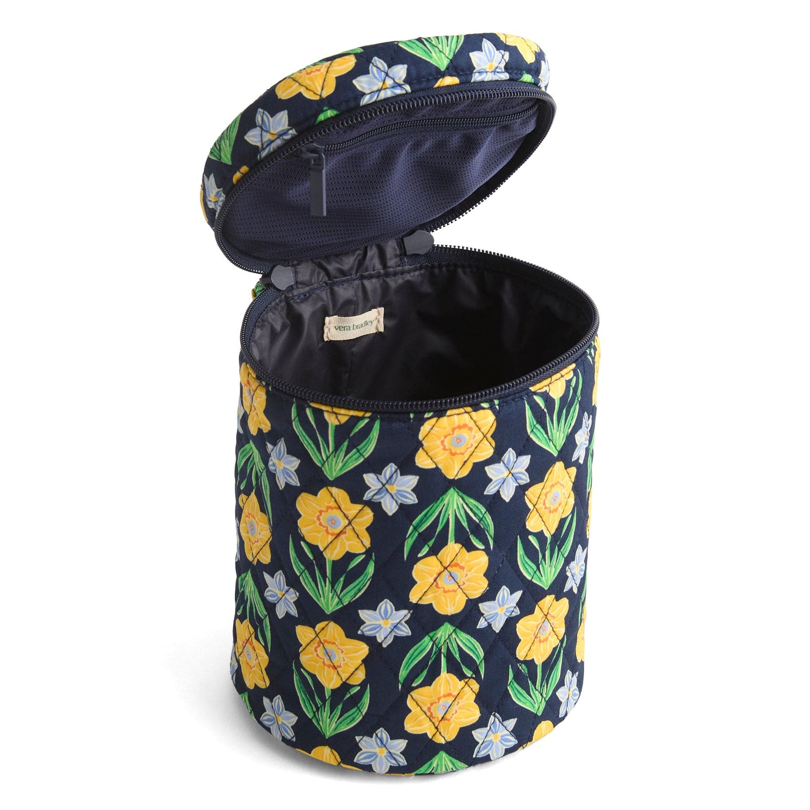 tall cylindrical cosmetic organizer in floral pattern with zip top open to show dark blue interior